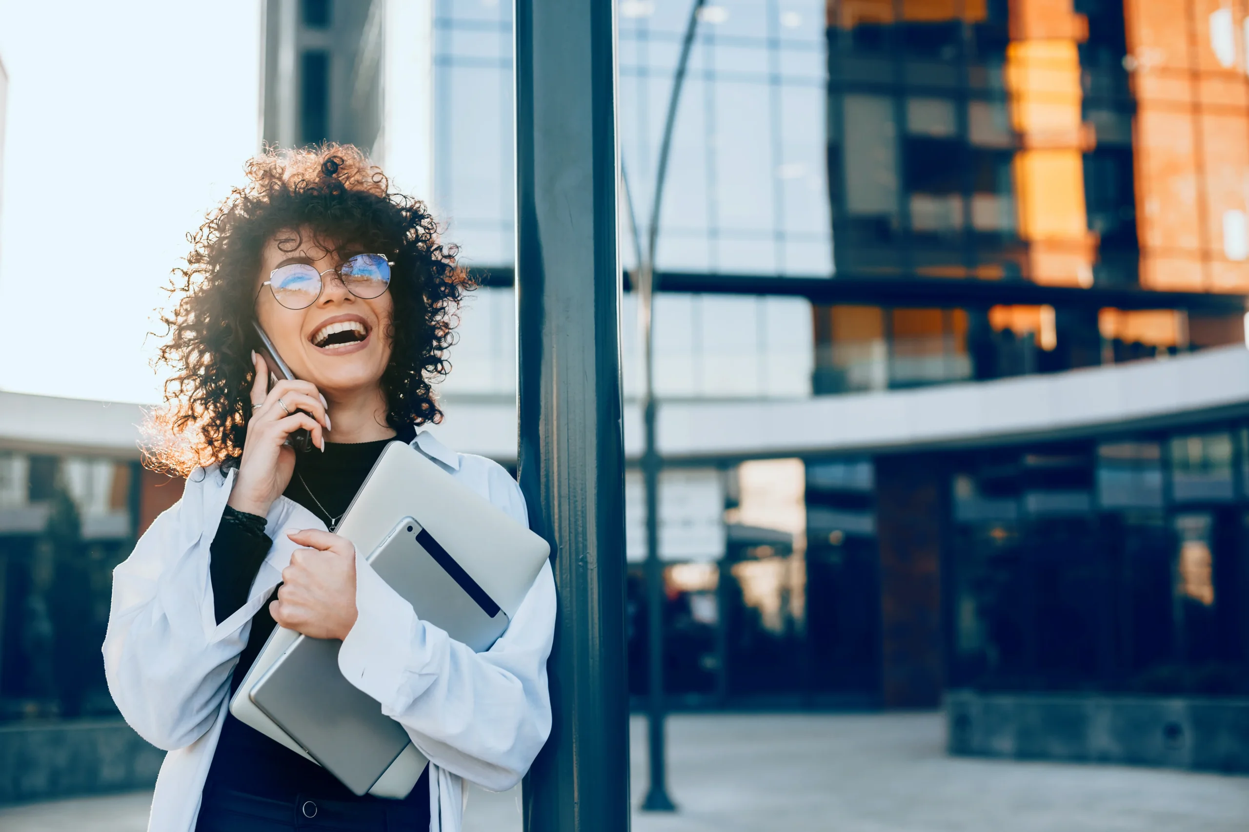 Happy female business owner enjoys the increased productivity of working flexibly.