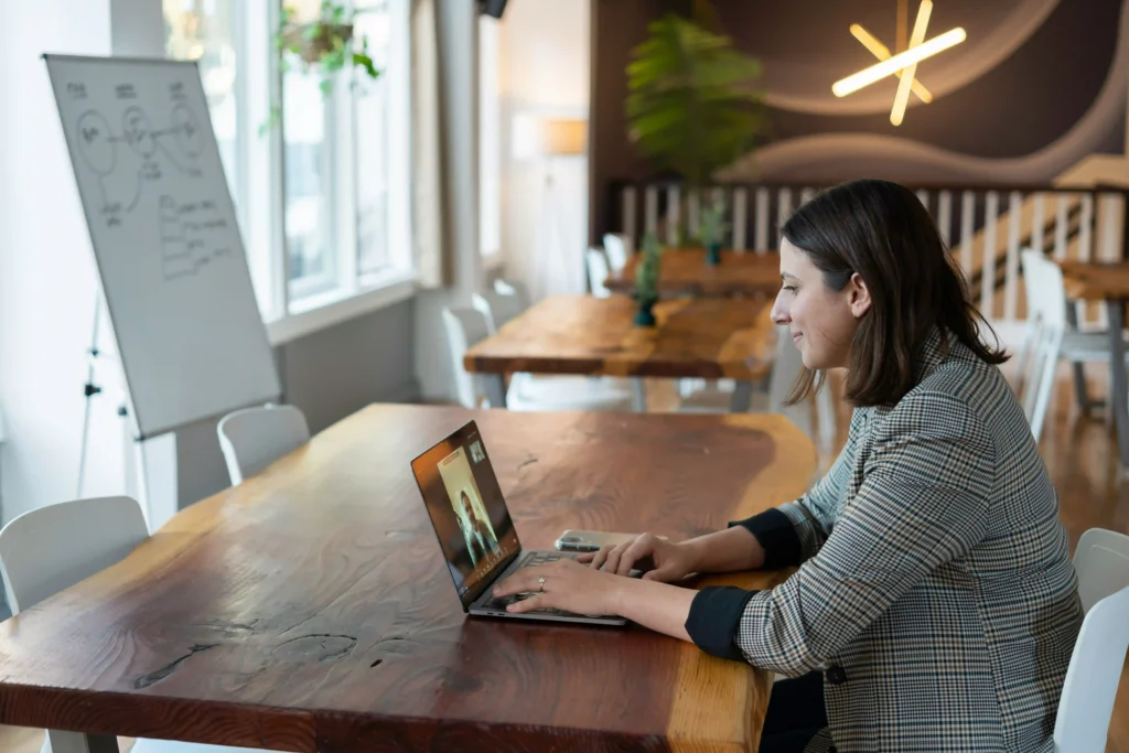 a young female business owner holds an interview using video conferencing.