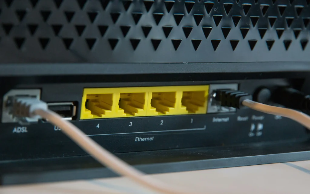 a close-up shot shows the back of a wireless router, ready to supply an internet connection.