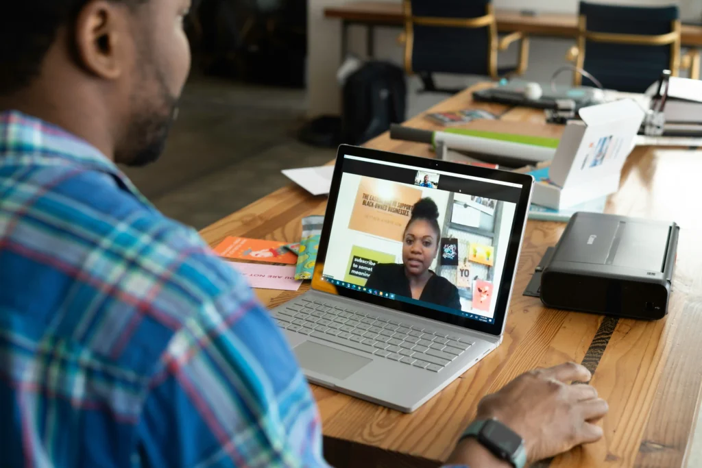 a young male business owner closes a deal using video conferencing.