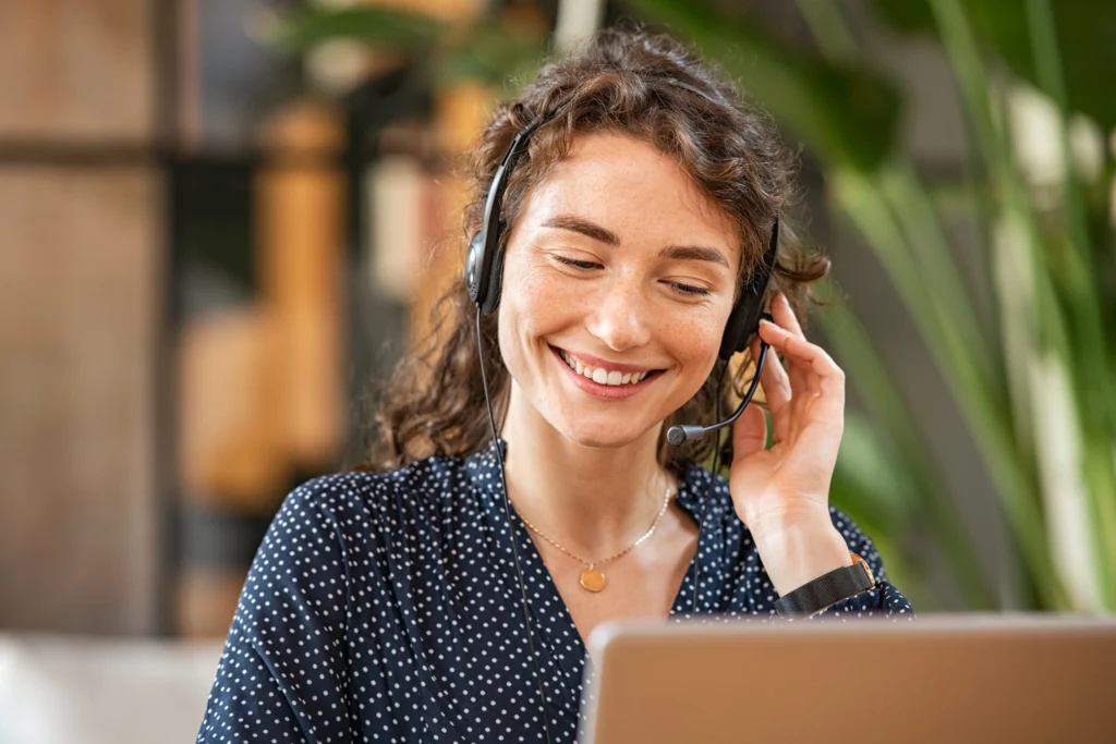 happy female employee enjoys flexible working through the use of voip technology.